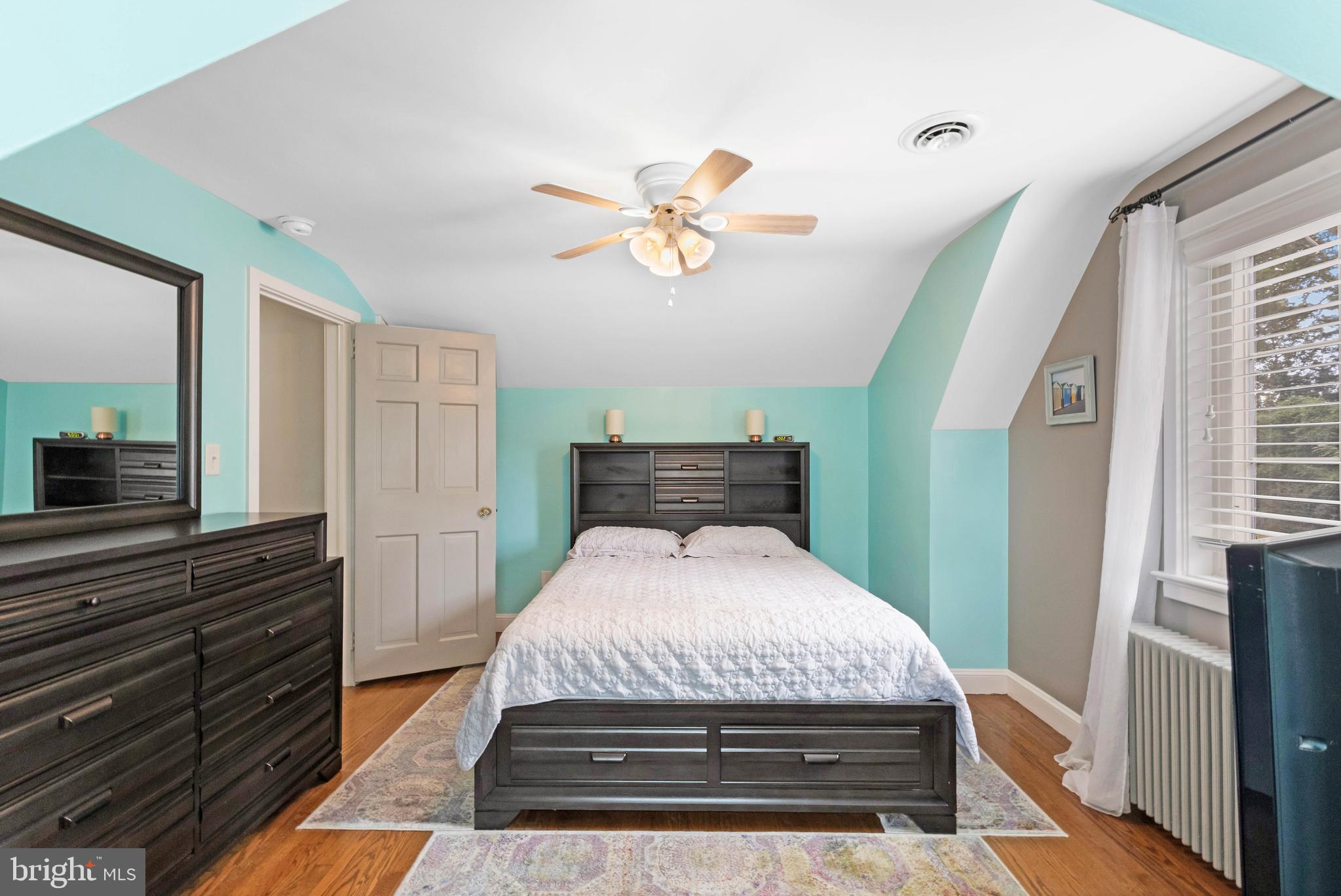 38 Read Street Seaford, DE 19973 - Photo 30 of 50 a bedroom with a bed and a chandelier