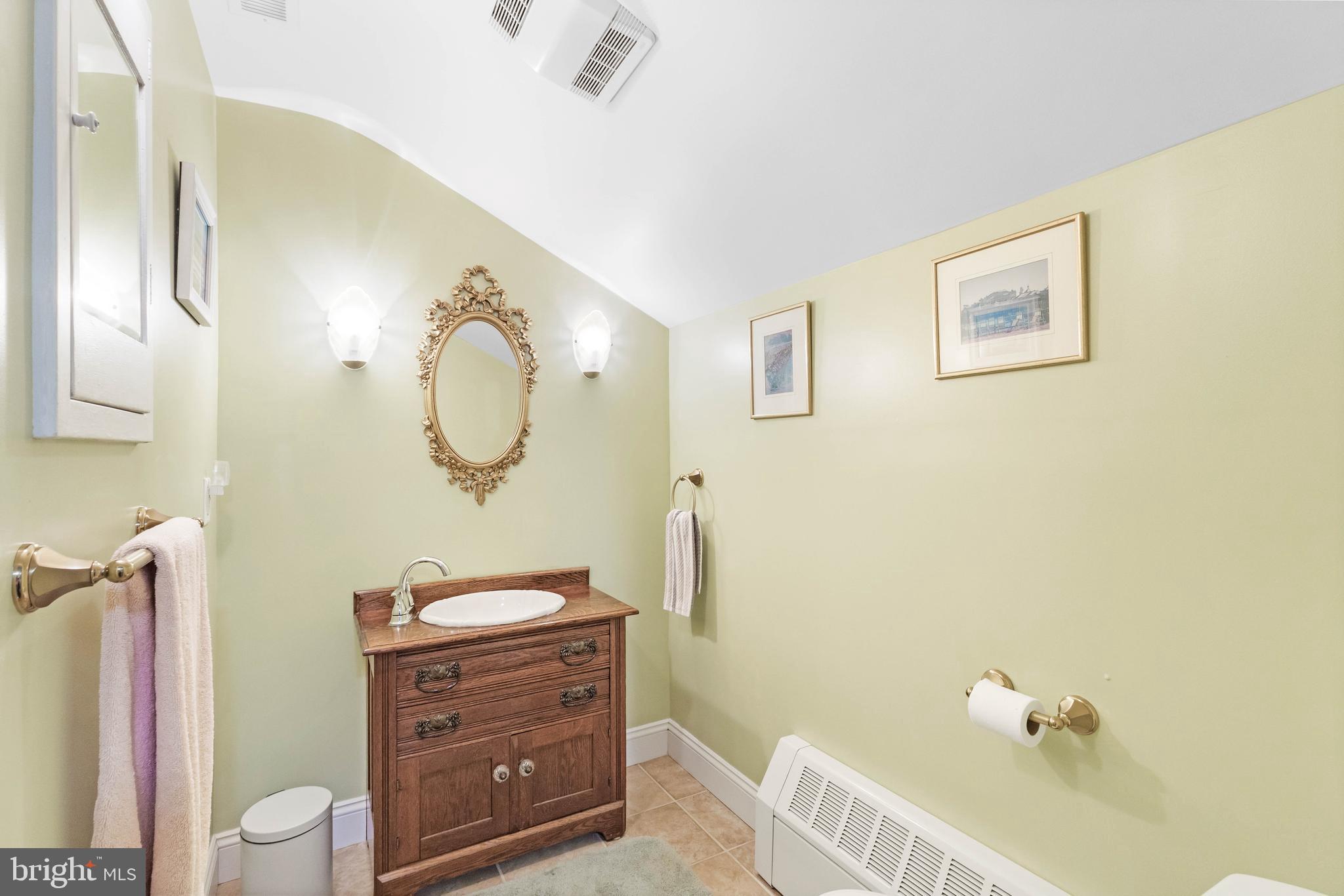 38 Read Street Seaford, DE 19973 - Photo 31 of 50 a bathroom with a sink a mirror and a toilet