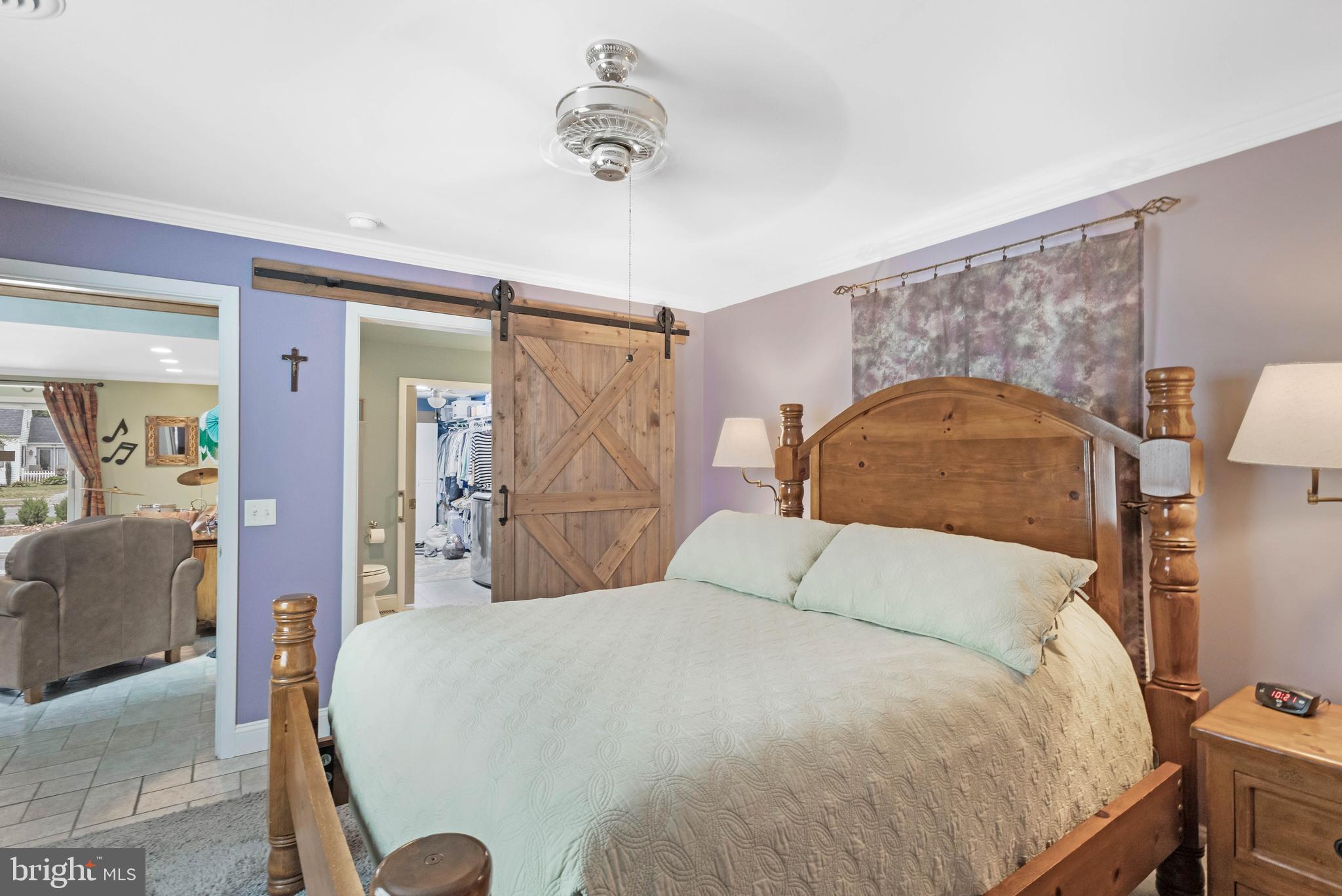 38 Read Street Seaford, DE 19973 - Photo 33 of 50 a bedroom with a large bed and a chandelier