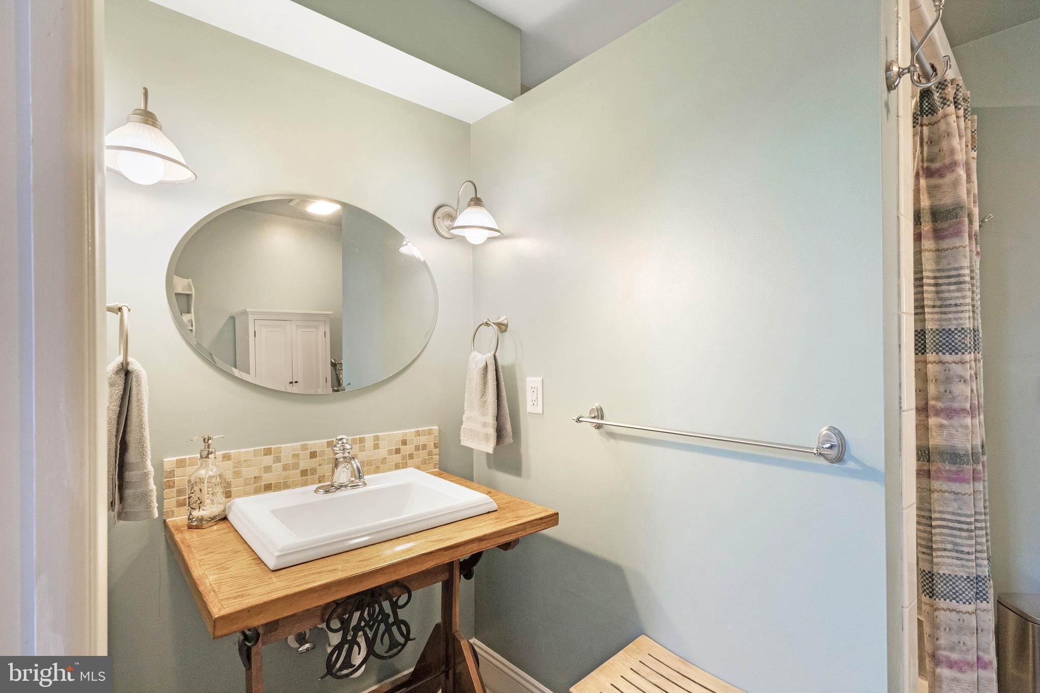 38 Read Street Seaford, DE 19973 - Photo 35 of 50 a bathroom with a sink a mirror and a toilet