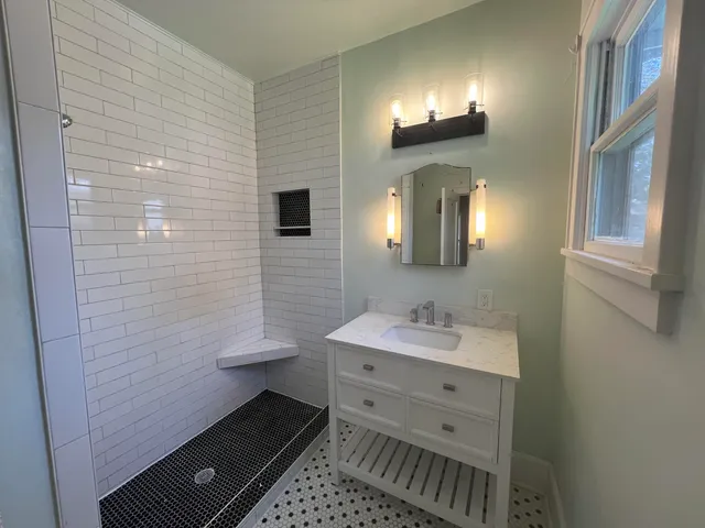 a bathroom with a sink and a mirror