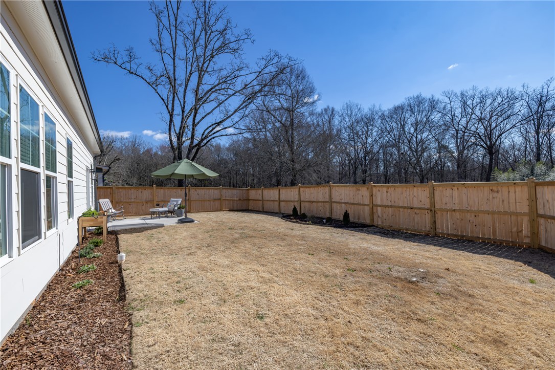 135 Bowers Estates Road Hartwell, GA 30643 - Photo 32 of 35 Enjoy outdoor living in this spacious yard, complete with a private patio area perfect for relaxation.