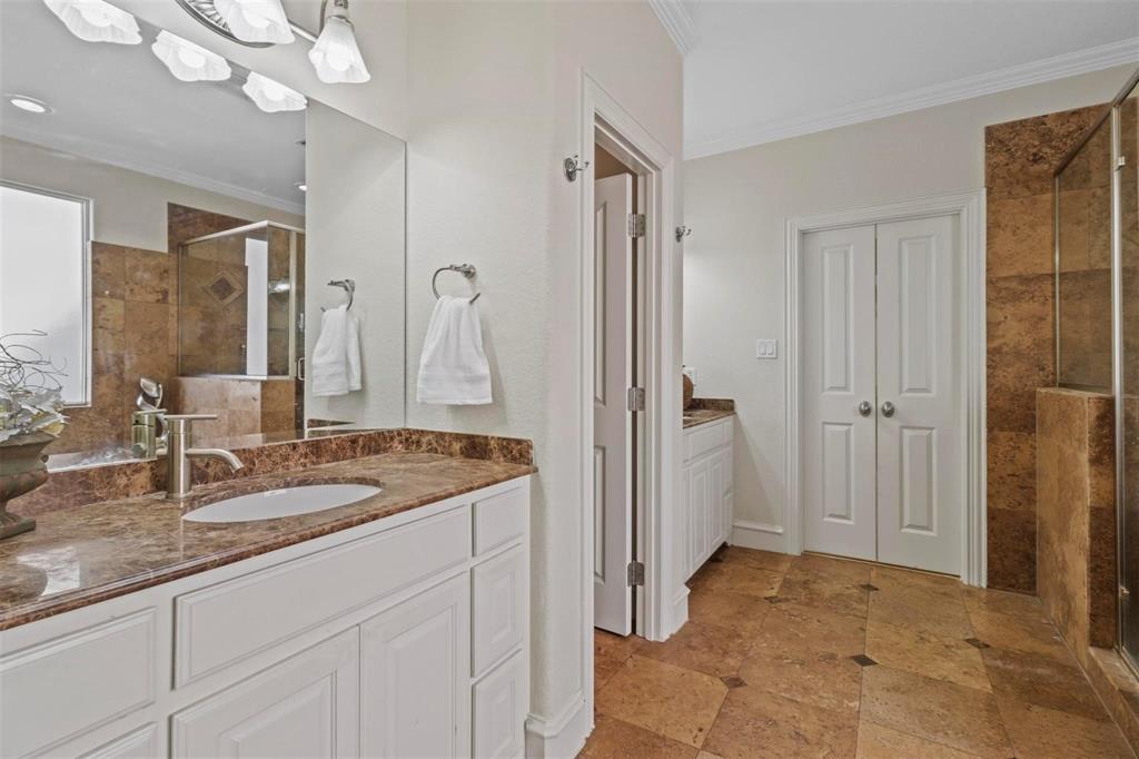 4516 Gilbert Avenue Dallas, TX 75219 - Photo 19 of 29 Owner Suite Bathroom with duel sinks and fire place!