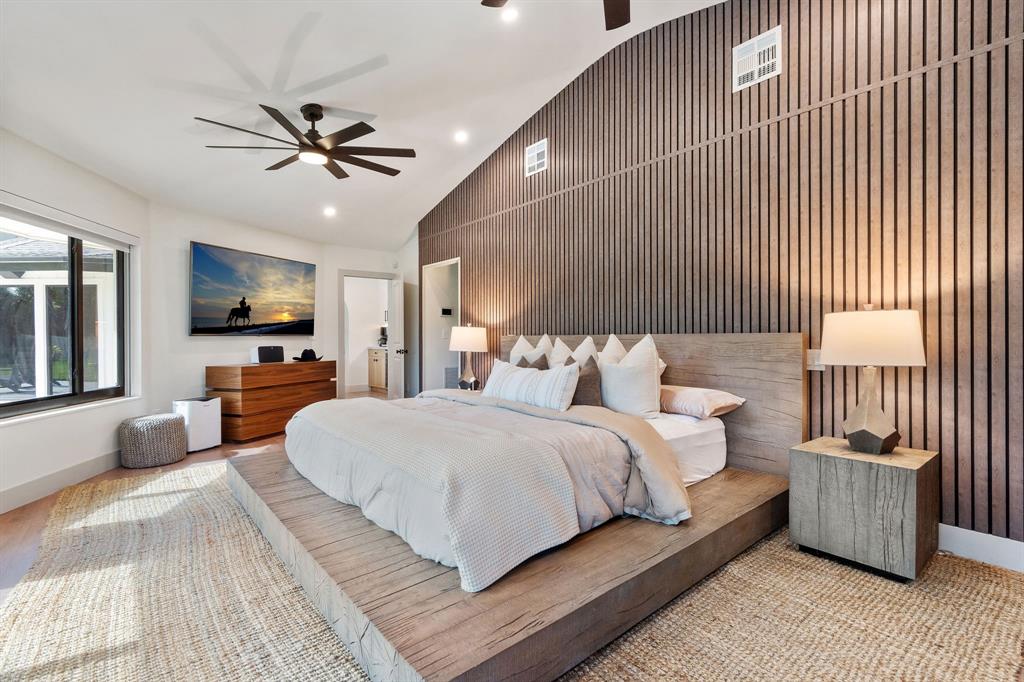 700 Old Nob Hill Road Plantation, FL 33324 - Photo 16 of 57 a bedroom with a large bed a flat tv screen and dresser