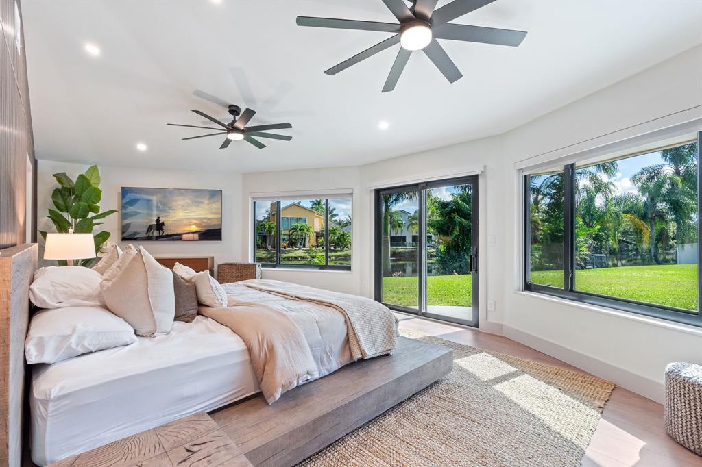 700 Old Nob Hill Road Plantation, FL 33324 - Photo 17 of 57 a bed room with a bed and a large window