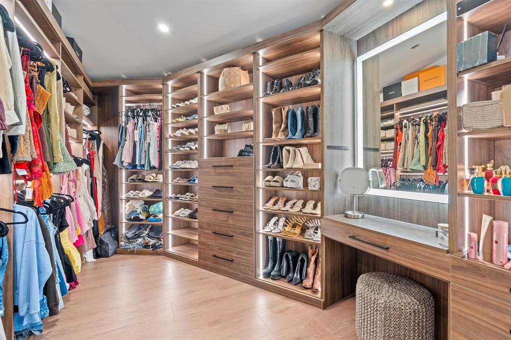 700 Old Nob Hill Road Plantation, FL 33324 - Photo 20 of 57 a view of walk in closet with clothes and shoes