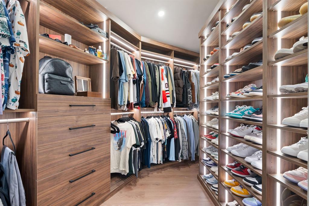 700 Old Nob Hill Road Plantation, FL 33324 - Photo 21 of 57 a view of walk in closet with clothes and shoes