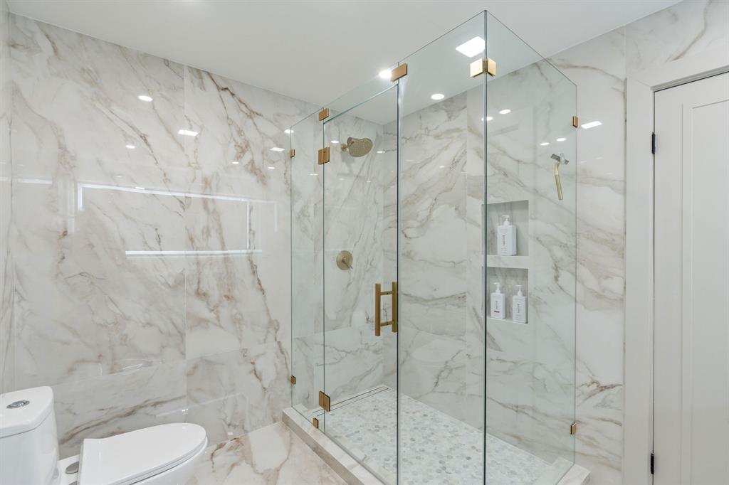 700 Old Nob Hill Road Plantation, FL 33324 - Photo 31 of 57 a bathroom with a shower a toilet and sink