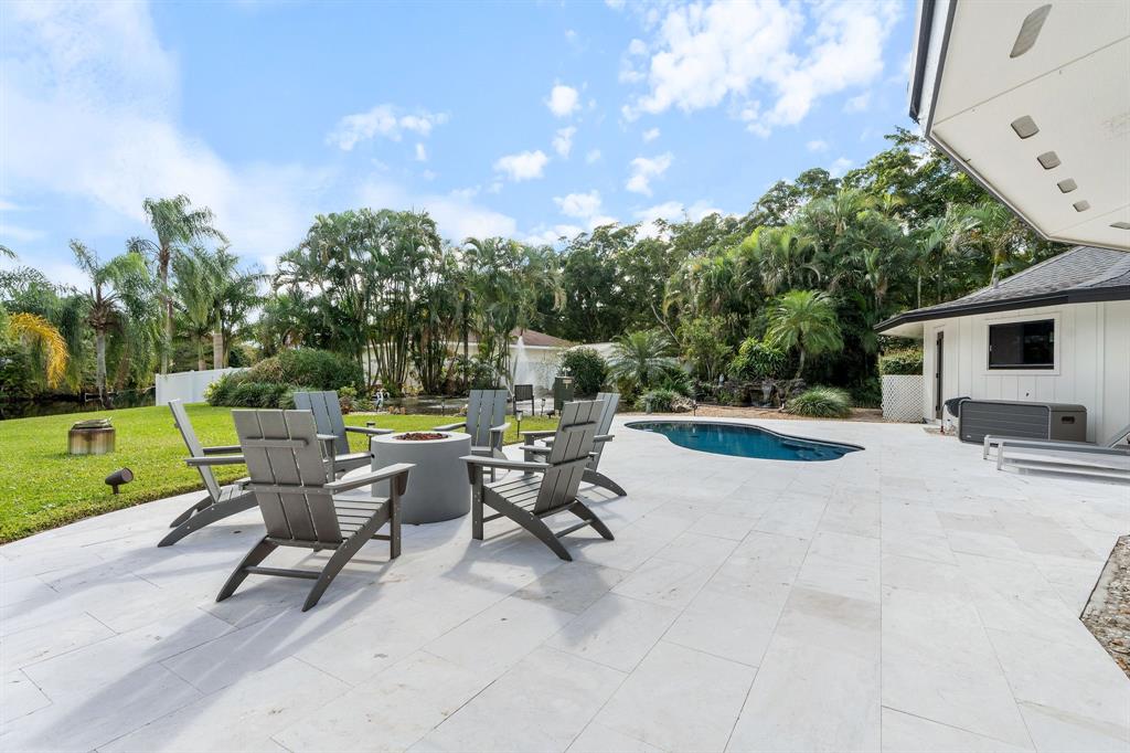 700 Old Nob Hill Road Plantation, FL 33324 - Photo 44 of 57 a view of a patio with a table and chairs