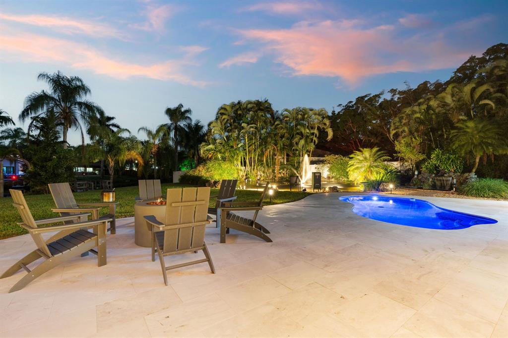 700 Old Nob Hill Road Plantation, FL 33324 - Photo 45 of 57 a view of a swimming pool with a lounge chairs