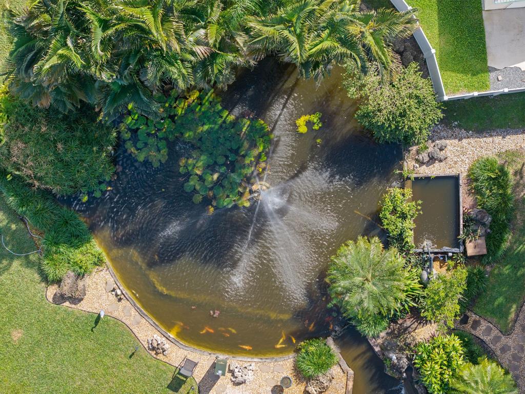 700 Old Nob Hill Road Plantation, FL 33324 - Photo 50 of 57 a view of a garden with a fountain
