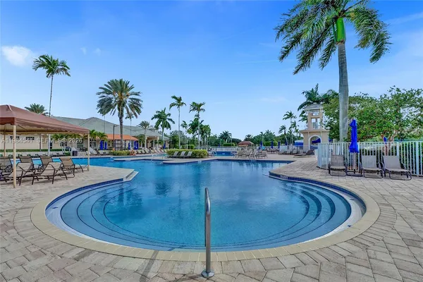 a view of a swimming pool with sitting area