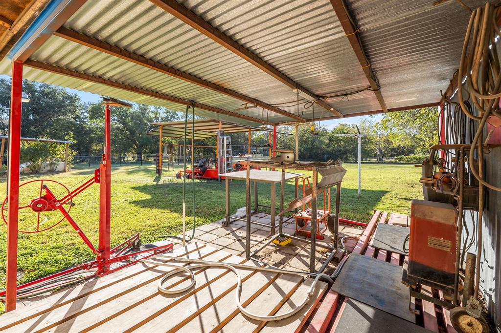 205 College Street Chico, TX 76431 - Photo 22 of 40 Fenced backyard with a patio