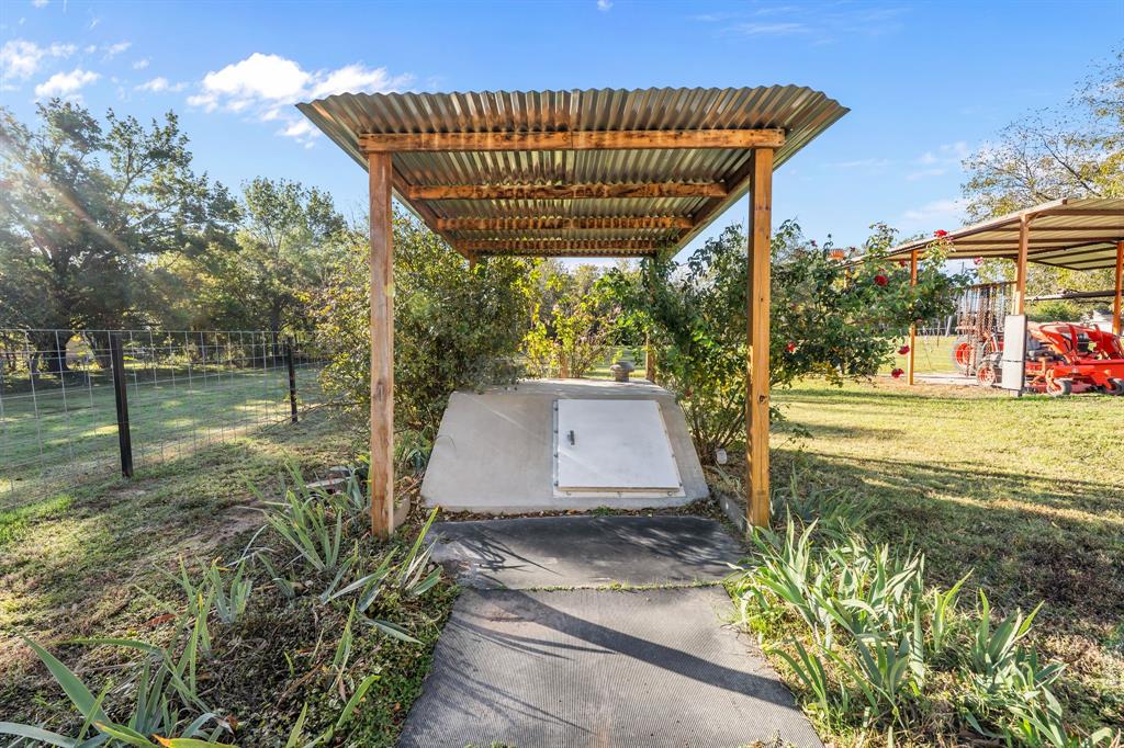 205 College Street Chico, TX 76431 - Photo 23 of 40 View of patio with a pergola