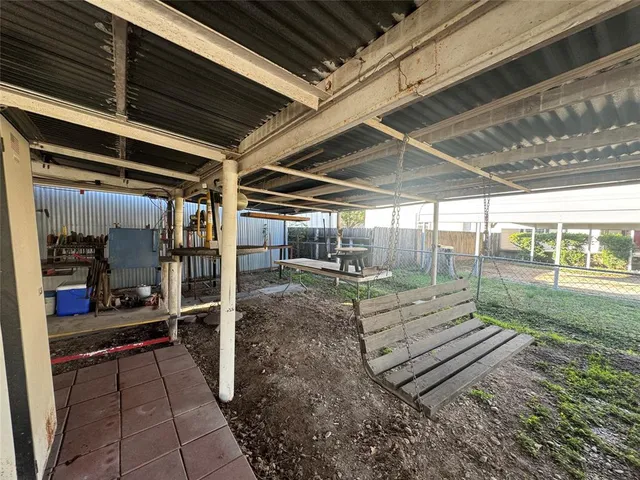 a view of a backyard of the house