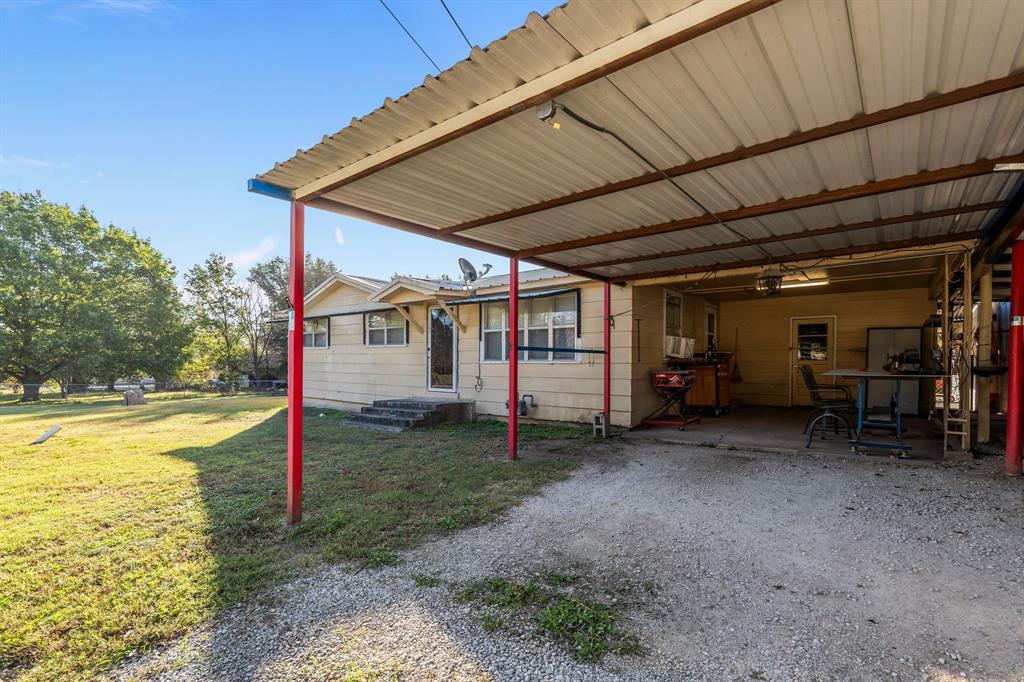205 College Street Chico, TX 76431 - Photo 6 of 40 a view of a house with backyard and roof