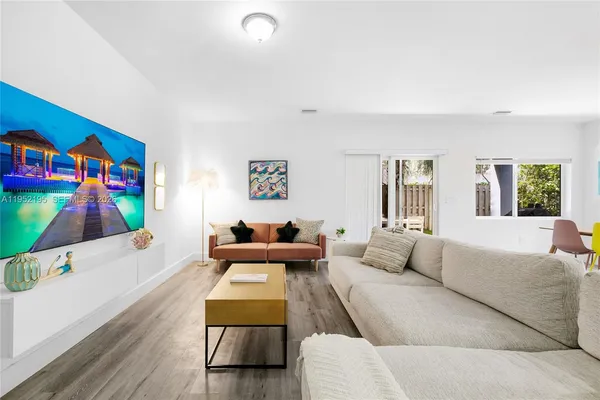 a living room with furniture and a window