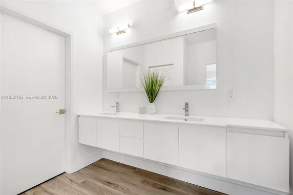 a bathroom with a sink and a mirror