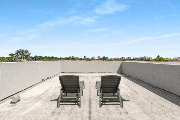 a view of a chairs and table in the terrace