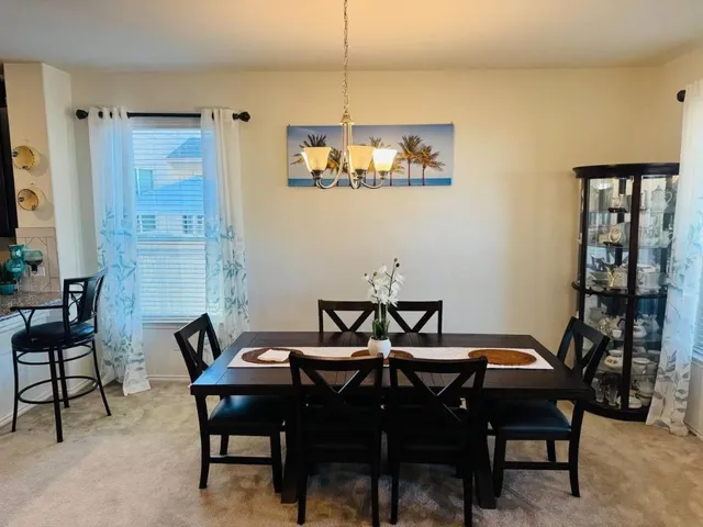 a view of a dining room with furniture