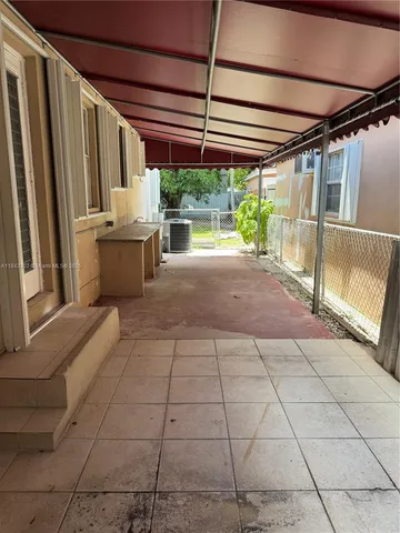 a view of backyard with a tub