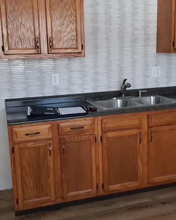 a view of a sink and a microwave