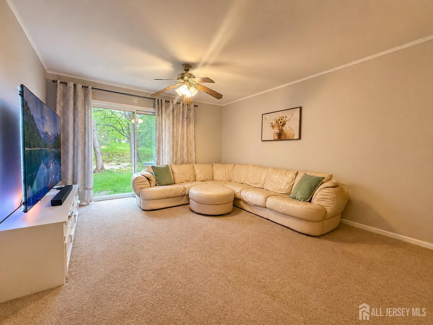 161 Applegate Lane East Brunswick, NJ 08816 - Photo 2 of 12 a living room with furniture and a flat screen tv