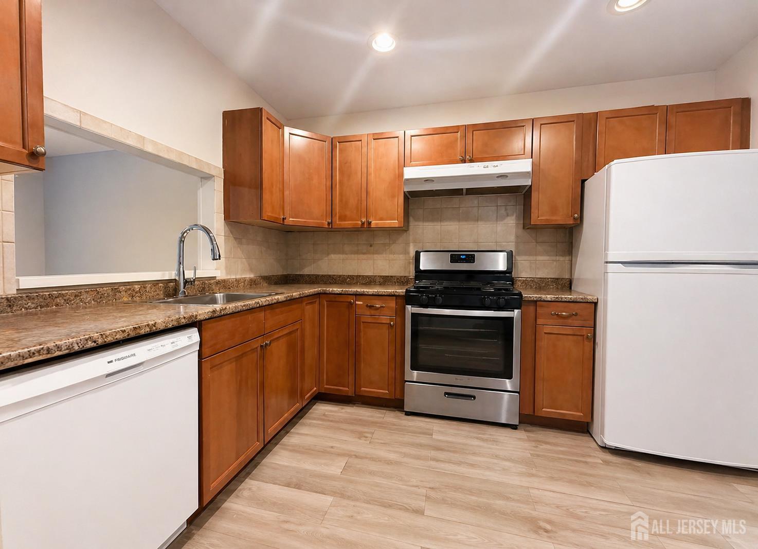 161 Applegate Lane East Brunswick, NJ 08816 - Photo 4 of 12 a kitchen with granite countertop a refrigerator and a sink