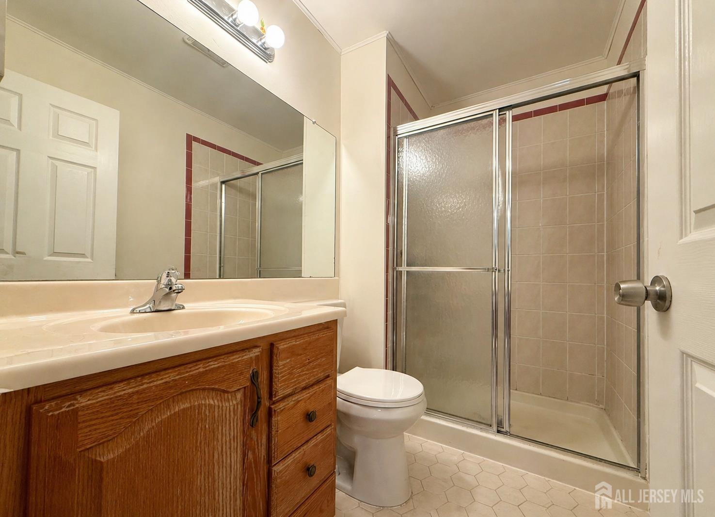 161 Applegate Lane East Brunswick, NJ 08816 - Photo 6 of 12 a bathroom with a sink a toilet and shower