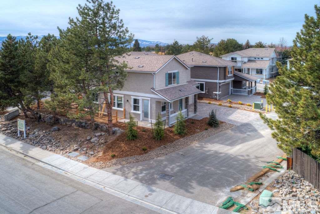 1441 Washington Street Reno, NV 89503 - Photo 4 of 9 a aerial view of a house with a yard and table and chairs under an umbrella