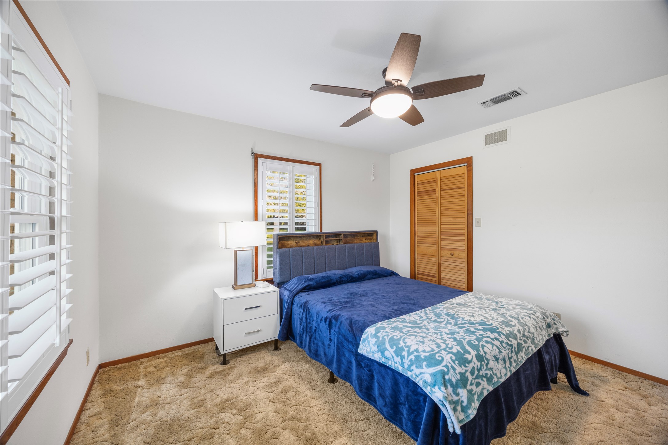 1324 Fair Drive Angleton, TX 77515 - Photo 18 of 42 a bedroom with a bed and a window