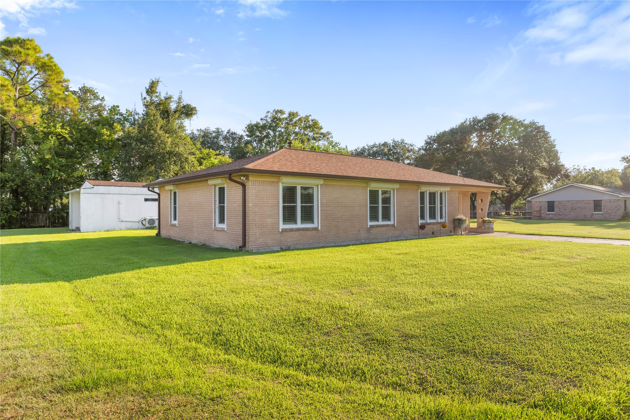1324 Fair Drive Angleton, TX 77515 - Photo 2 of 42 a front view of house with yard and lake view