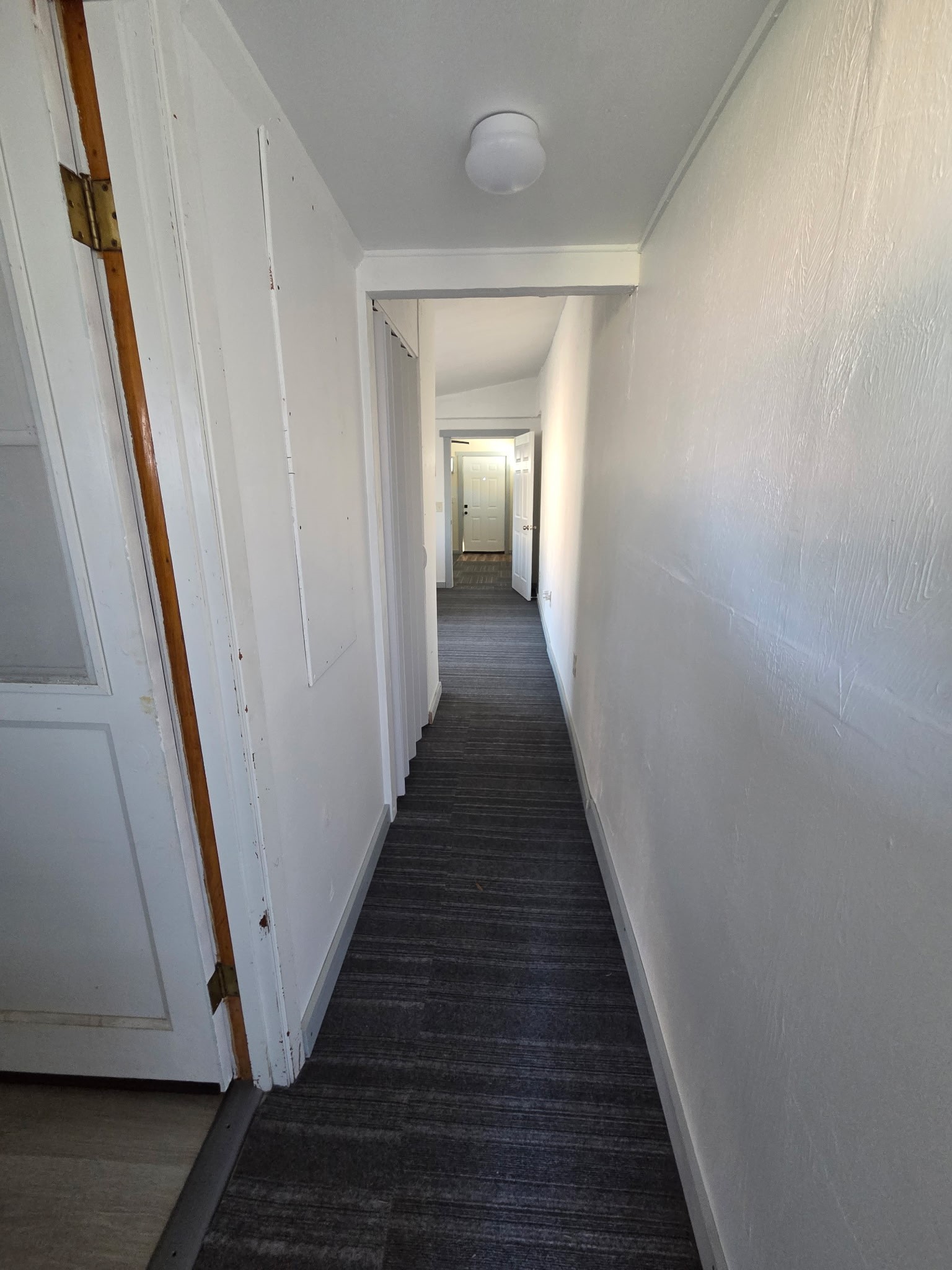 1324 Fair Drive Angleton, TX 77515 - Photo 24 of 42 a view of a hallway with wooden floor and staircase