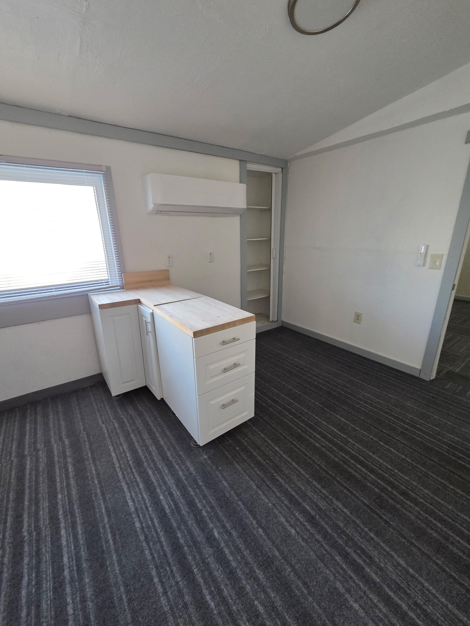 1324 Fair Drive Angleton, TX 77515 - Photo 34 of 42 a room with a bed and cabinets