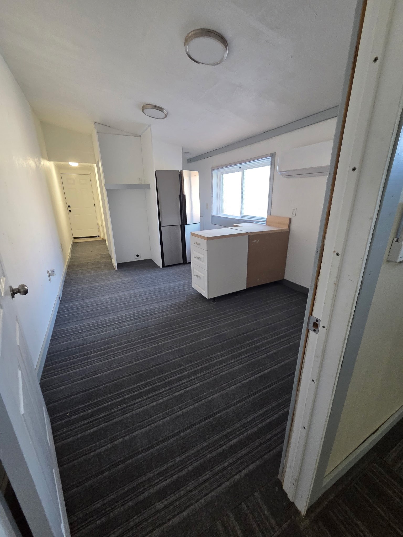 1324 Fair Drive Angleton, TX 77515 - Photo 35 of 42 a view of an empty room with wooden floor and a window