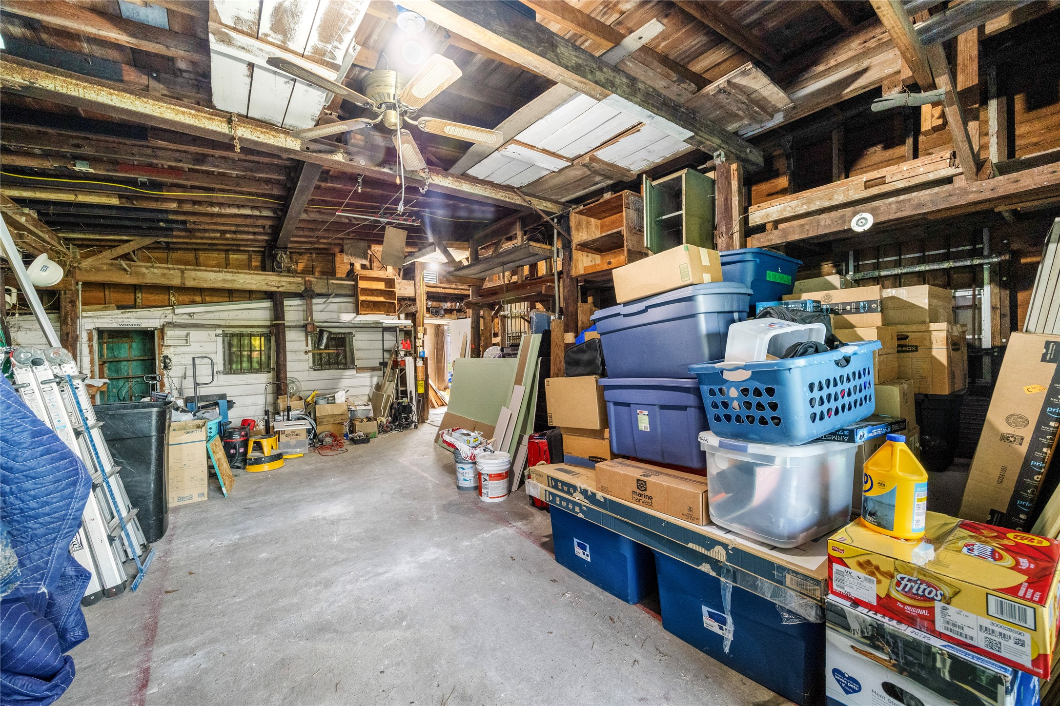 1324 Fair Drive Angleton, TX 77515 - Photo 39 of 42 a view of store room with clothes