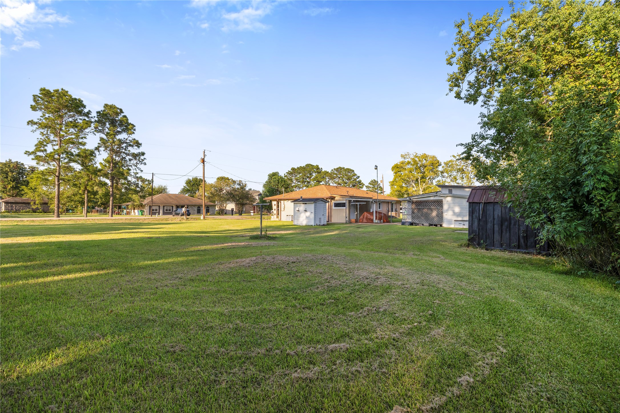 1324 Fair Drive Angleton, TX 77515 - Photo 5 of 42 a view of a green field with house in the background