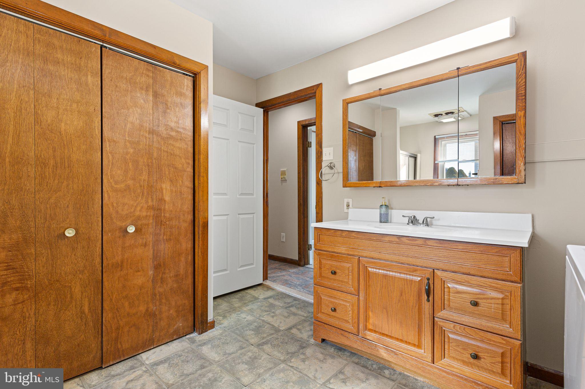 2623 Knights Road Bensalem, PA 19020 - Photo 26 of 50 a bathroom with a double vanity sink mirror and shower