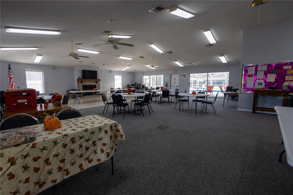 Forest Glenn Dr Spring Hill Spring Hill, FL 34607 - Photo 12 of 31 a living room with lots of furniture and a flat screen tv