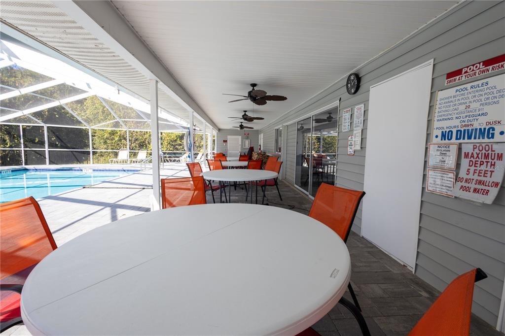 Forest Glenn Dr Spring Hill Spring Hill, FL 34607 - Photo 27 of 31 a dining room with furniture and wooden floor