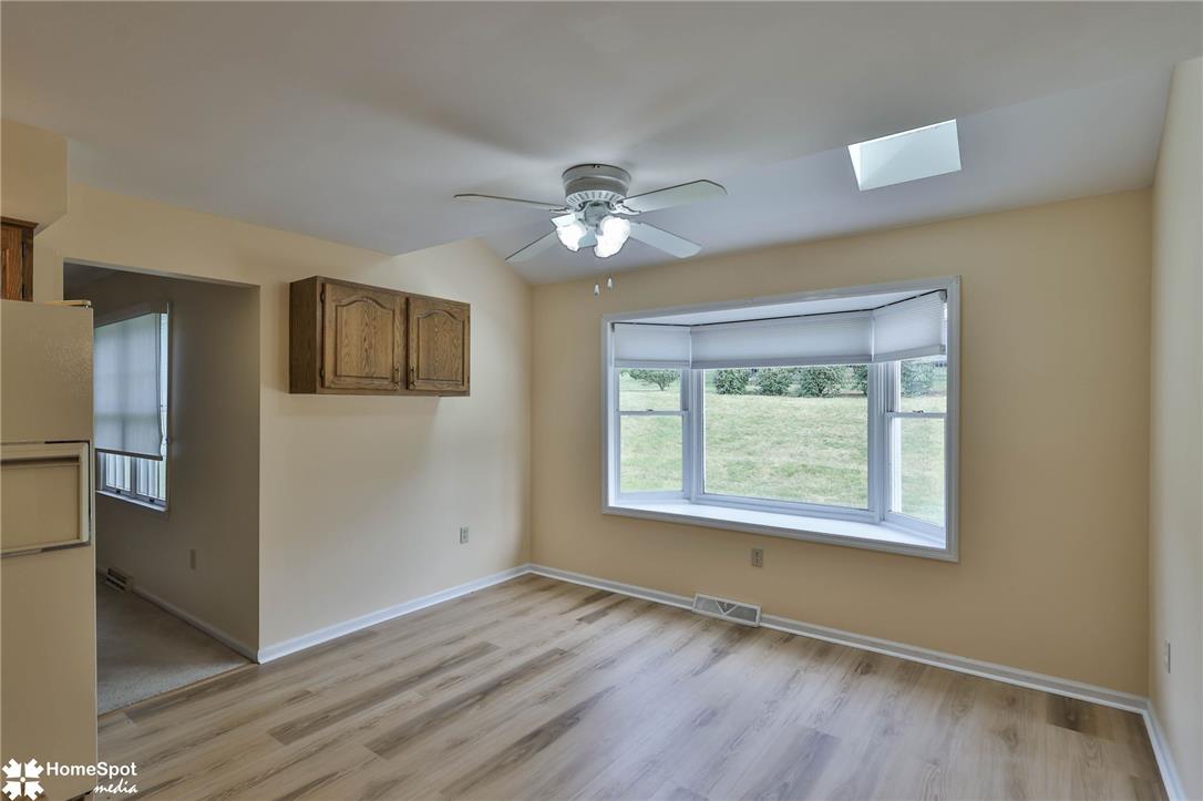 4059 Wedgewood Road Allentown, PA 18104 - Photo 14 of 72 A well-lit eating area featuring a wide bay window and overhead illumination.