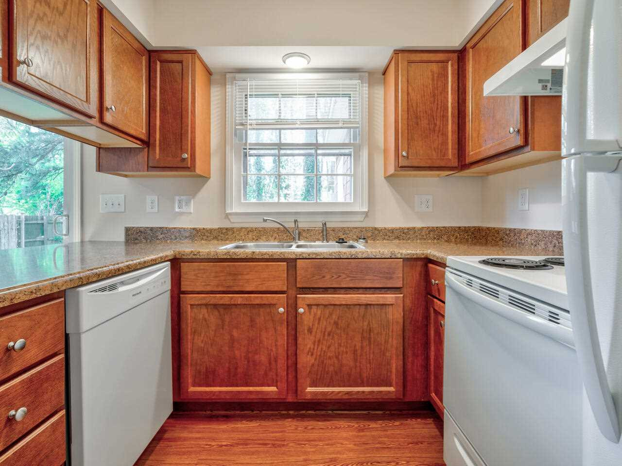 2220 New Hope Church Road Raleigh, NC 27604 - Photo 13 of 30 a kitchen with stainless steel appliances granite countertop a stove a sink and a microwave