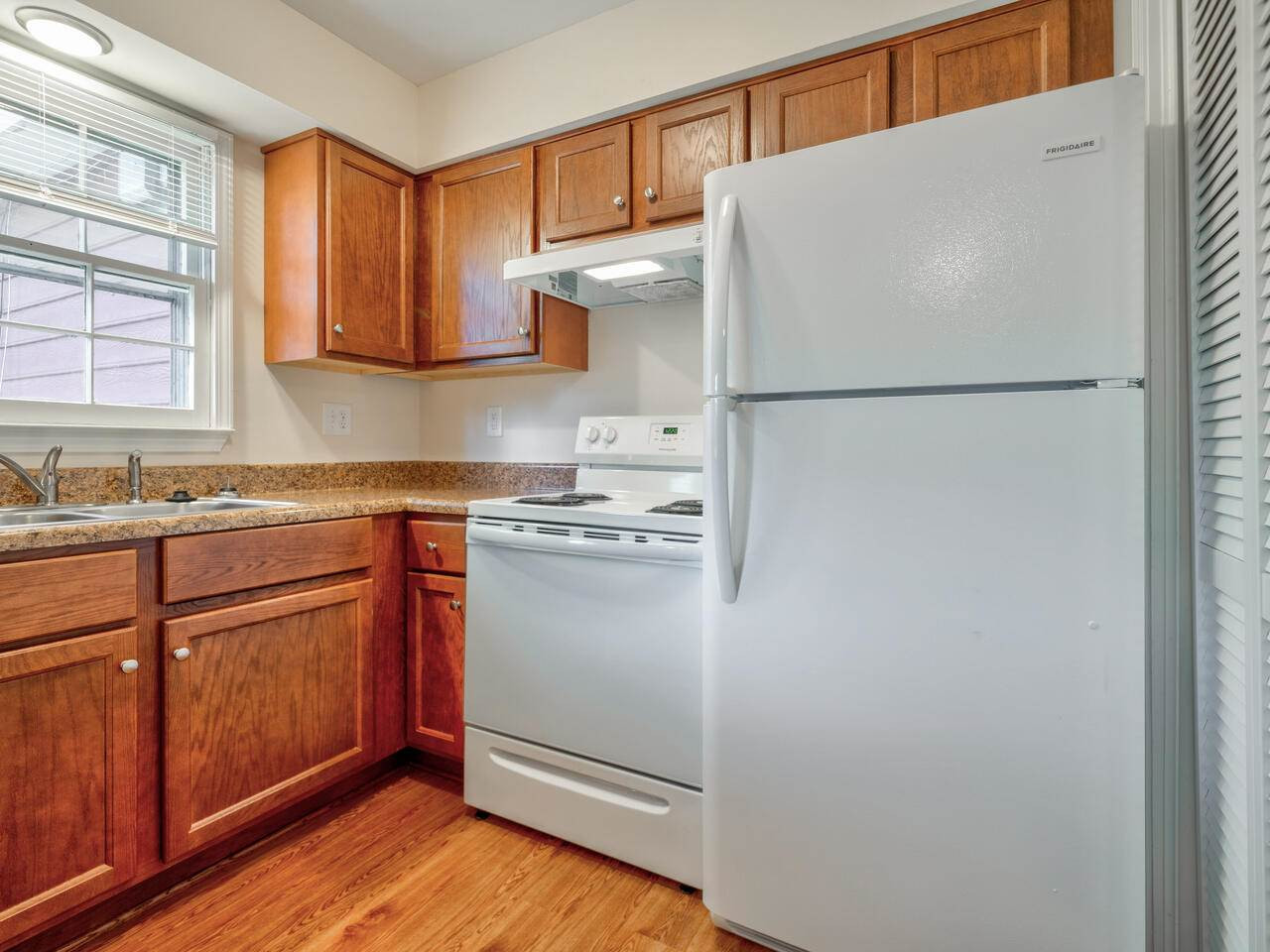 2220 New Hope Church Road Raleigh, NC 27604 - Photo 15 of 30 a kitchen with a refrigerator sink and cabinets