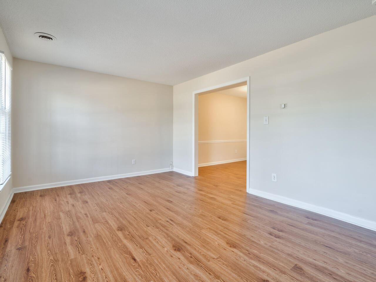 2220 New Hope Church Road Raleigh, NC 27604 - Photo 6 of 30 a view of an empty room with wooden floor