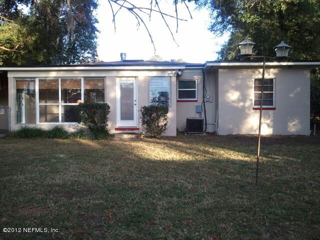 6038 Stetson Road Jacksonville, FL 32217 - Photo 12 of 55 a front view of a house with a yard
