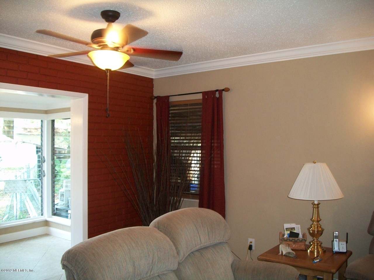 6038 Stetson Road Jacksonville, FL 32217 - Photo 20 of 55 a bedroom with furniture and a chandelier