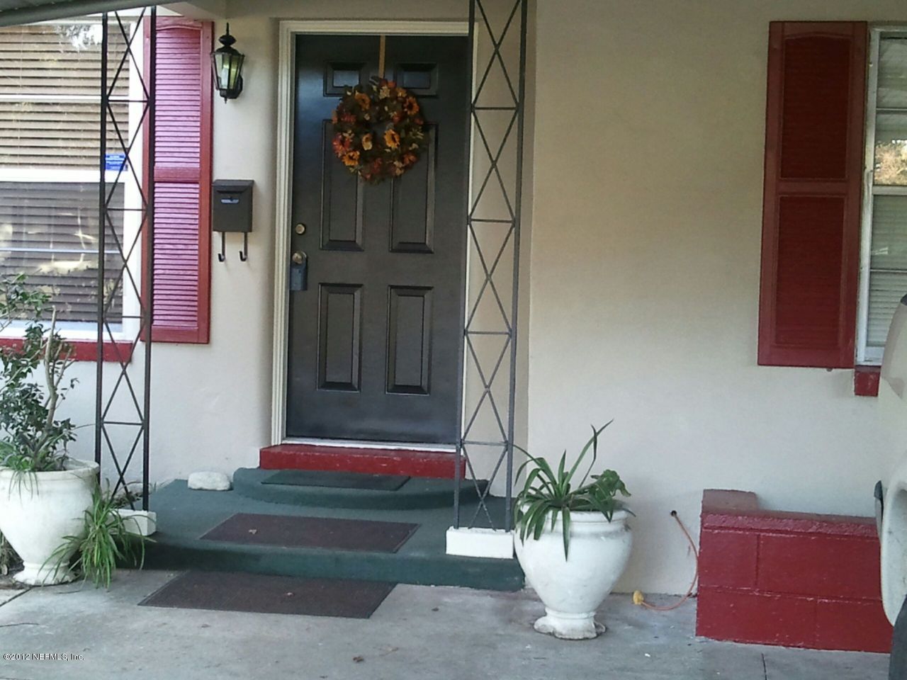 6038 Stetson Road Jacksonville, FL 32217 - Photo 2 of 55 a potted plant sitting on the side of a building