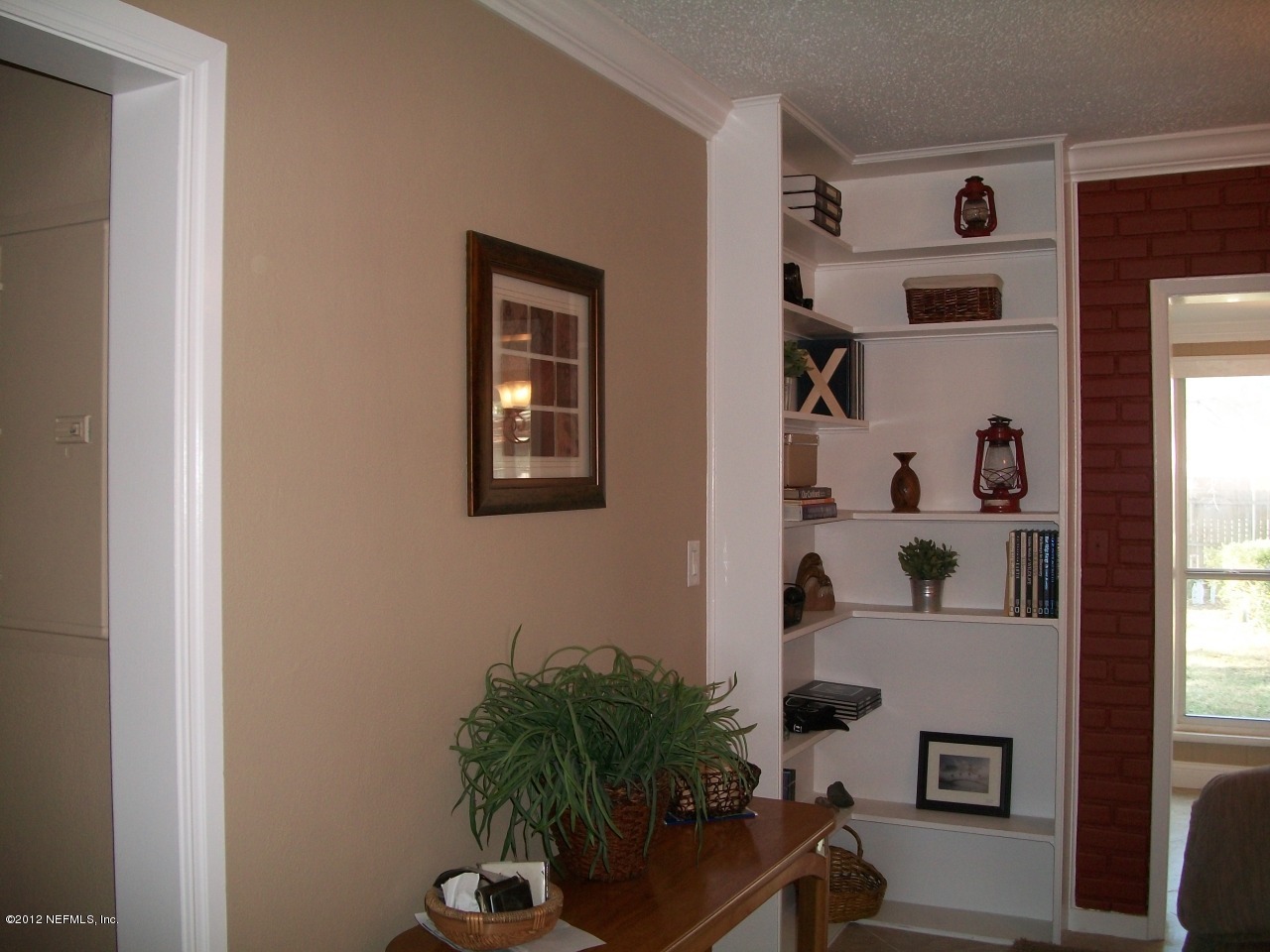6038 Stetson Road Jacksonville, FL 32217 - Photo 23 of 55 a vase of flowers sitting on a table in front of a window
