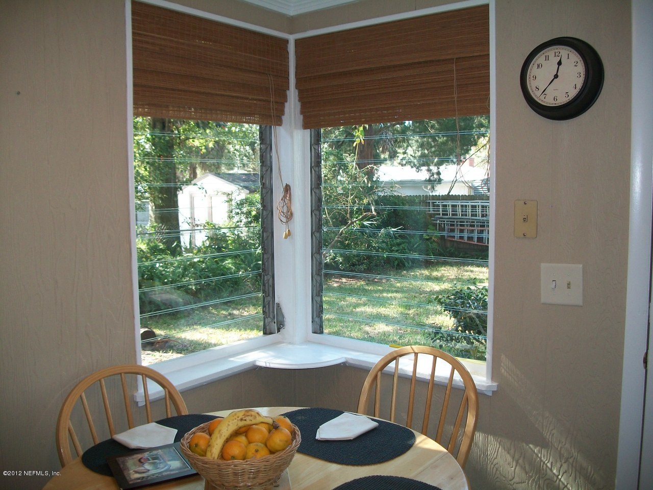 6038 Stetson Road Jacksonville, FL 32217 - Photo 36 of 55 a view of a living room with furniture and a floor to ceiling window