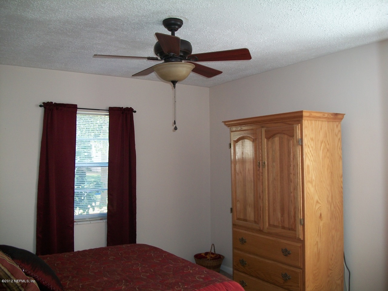 6038 Stetson Road Jacksonville, FL 32217 - Photo 42 of 55 a bedroom with a bed and a window